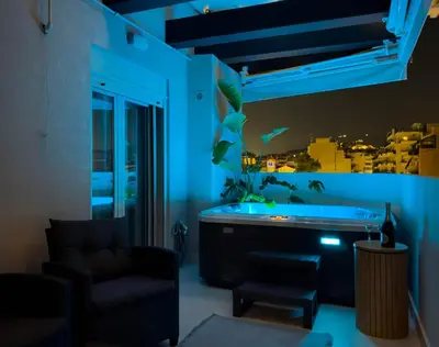 a living room with blue lighting and a couch at AirRent Apartments 4 Jacuzzi Suite in Athens