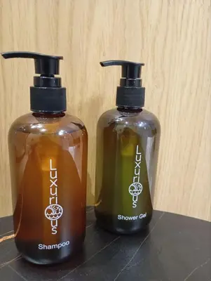 two bottles of soap sitting next to each other at AirRent Apartments 4 Jacuzzi Suite in Athens