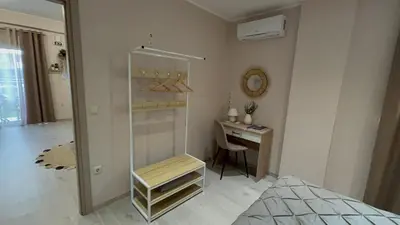 a bedroom with a desk and a glass shower at Mocha Luxury Residence in Spáta