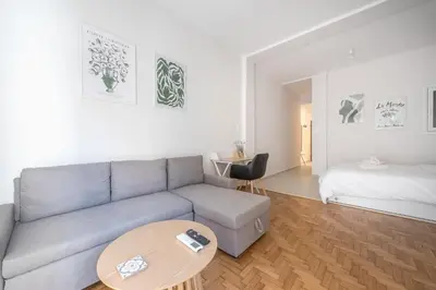 a living room with a couch and a table at Athens F&K Premium City Home in Athens