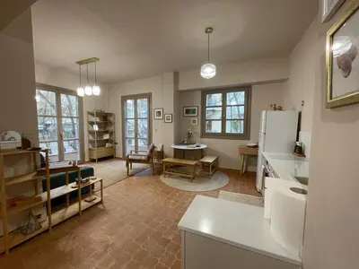 a kitchen and living room with a refrigerator and a table at Chillout in Athens in Athens
