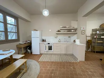 a kitchen with a white refrigerator and a table at Chillout in Athens in Athens