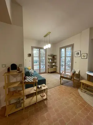 a living room with a couch and a table at Chillout in Athens in Athens