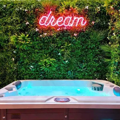a bath tub in front of a sign that says dream at The Dream Suite in Piraeus