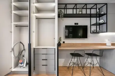 a room with a desk and two bar stools at Avia Deluxe Studio - Athens Modern Escape in Athens