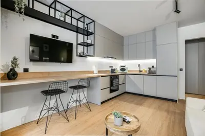 a kitchen with a counter and stools in a room at Avia Deluxe Studio - Athens Modern Escape in Athens