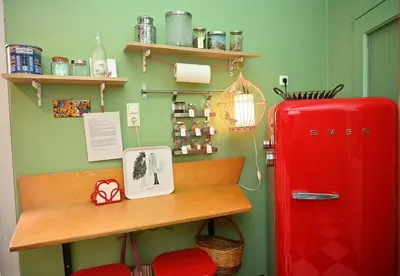 a room with a desk and a red refrigerator at Bibelot Acropolis in Athens