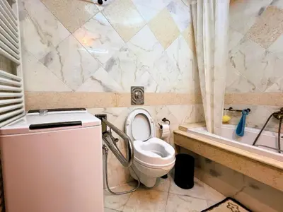 a bathroom with a toilet and a sink and a tub at Bella Vista pool Villas in Anavissos in Barbaliáki