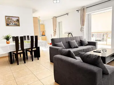 a living room with a couch and a table at \u51ef\u5b81\u6c11\u5bbf in Piraeus