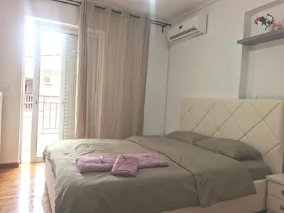 a bedroom with a bed with two towels on it at \u51ef\u5b81\u6c11\u5bbf in Piraeus