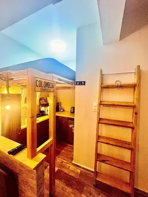 a room with a bunk bed and a kitchen at Couple Nest in Athens