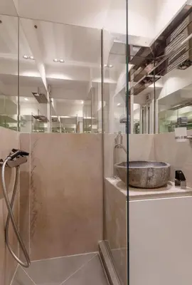 a bathroom with a shower and a sink at Acropolis Museum Retreat by GHH in Athens