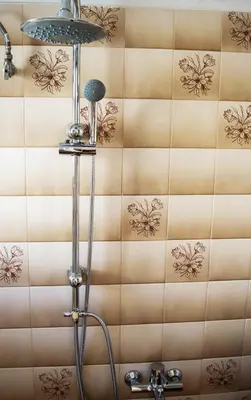 a shower in a bathroom with a tile wall at Downtown Cozy penthouse For balcony lovers in Athens