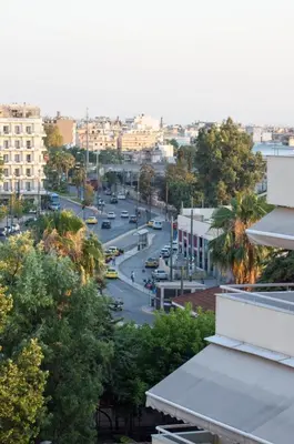 a view of a city street with cars on the road at Downtown Cozy penthouse For balcony lovers in Athens