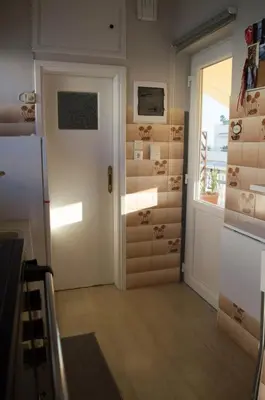 a room with a door leading to a room with a window at Downtown Cozy penthouse For balcony lovers in Athens