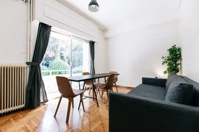 a living room with a couch and a table at Happy Rabbit 4 in Athens