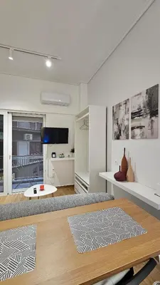 a living room with a couch and a table at Elegant City Retreat Walk to Landmarks & Metro in Athens