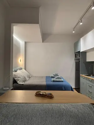 a bedroom with a bed with shoes on it at Elegant City Retreat Walk to Landmarks & Metro in Athens