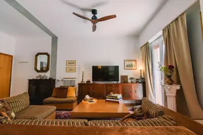 a living room with a couch and a table at Spacious Apartment in Lycabettus Hill in Athens