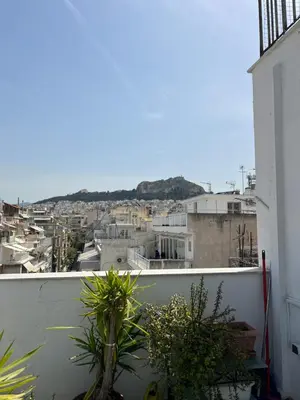 a view of a city from an apartment balcony at Nina's Home in Athens