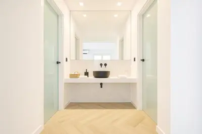 a bathroom with a sink and a mirror at Triple A - Golden Eight - On Aiolou Downtown - FREE Parking! in Athens