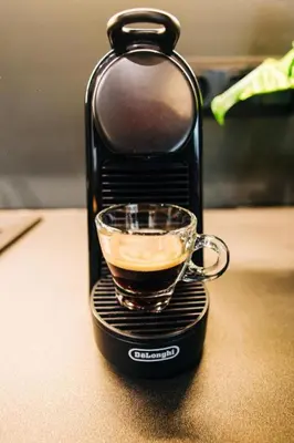 a cup of coffee in a espresso machine at Triple A - Golden Eight - On Aiolou Downtown - FREE Parking! in Athens