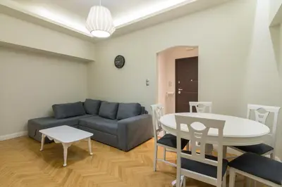 a living room with a couch and a table at Centrally Located Apt for 3 People in Athens