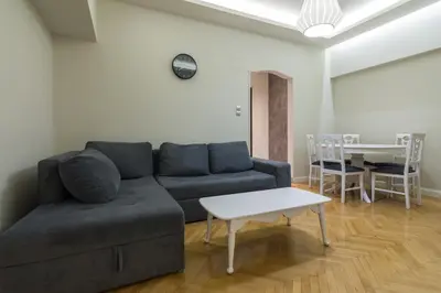 a living room with a couch and a table at Centrally Located Apt for 3 People in Athens