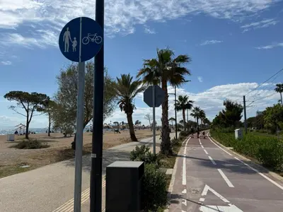 a street sign on the side of a road near the beach at Exclusive Penthouse Apt, at Glyfada Marina & Beach in Athens