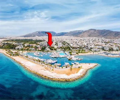 an aerial view of a beach with boats in the water at Exclusive Penthouse Apt, at Glyfada Marina & Beach in Athens