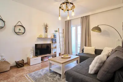 a living room with a couch and a table at ConEviKa in Athens