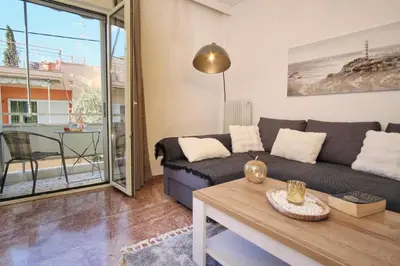a living room with a couch and a table at ConEviKa in Athens