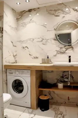 a bathroom with a washing machine and a sink at Theo Apartments in Athens Center in Athens