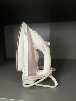 a white phone sitting on top of a table at my HOME in Athens