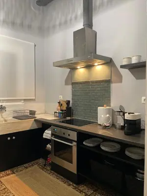 a kitchen with a stove and a stove top oven at my HOME in Athens