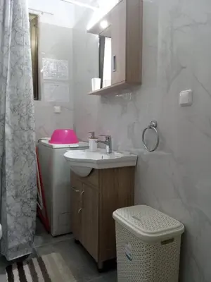 a bathroom with a sink and a toilet at 2BD apartment with large balcony near the sea!! in Athens
