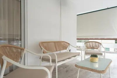 a living room with two chairs and a table at Upscale Apartment in Chalandri with Large Terrace in Athens