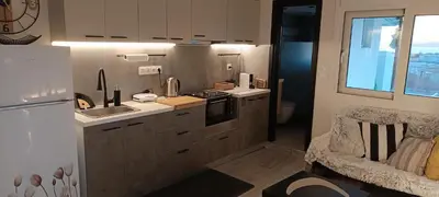 a small kitchen with a sink and a stove at Homeyfeel StayTOP - ΑΡΓΥΡΟΥΠΟΛΗ - ΕΛΛΗΝΙΚΟ in Athens