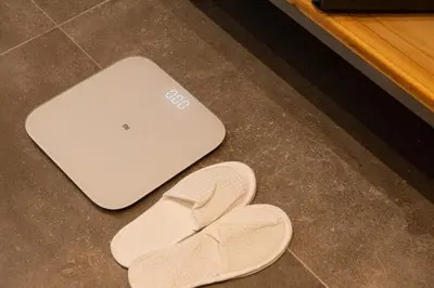 a pair of sandals and a laptop computer on the floor at Evia Hotel in Athens