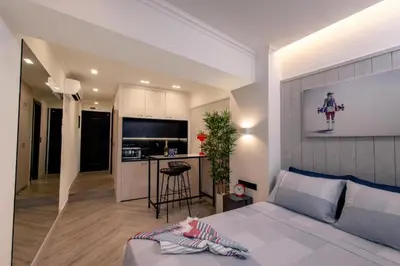 a bedroom with a bed and a kitchen with a counter at Triple A - Psiri Nightlife at Theatrou Square - Urban Studios - FREE Parking! in Athens