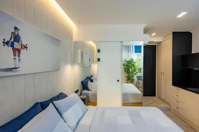 a hotel room with a bed and a television at Triple A - Psiri Nightlife at Theatrou Square - Urban Studios - FREE Parking! in Athens