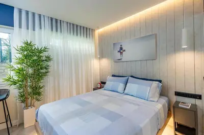 a bedroom with a bed and a plant in it at Triple A - Psiri Nightlife at Theatrou Square - Urban Studios - FREE Parking! in Athens