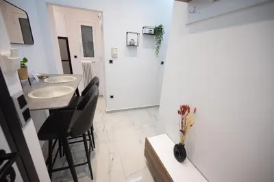 a kitchen and dining room with a table and chairs at Athens Modern Hub in Athens