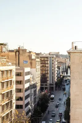 an overhead view of a city street with cars at WYZ Museum by UPSTREET in Athens