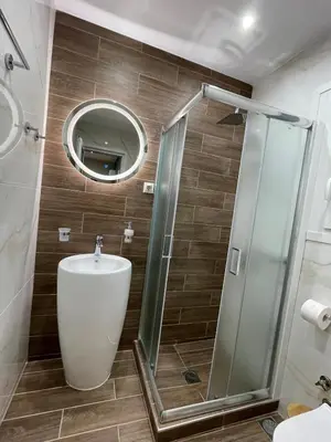 a bathroom with a sink and a shower at FilOikos Privacy Nest Retreat 3Br 3Ba En-Suite in Athens