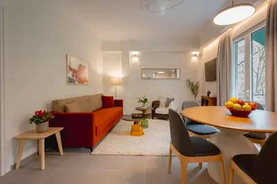 a living room with a couch and a table at Mia Homes - Acropolis in Athens