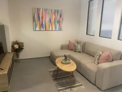 a living room with a couch and a table at Heart of Athens Stay #5 in Athens