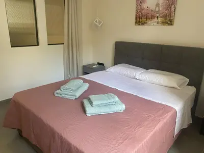 a bedroom with a bed with two towels on it at Heart of Athens Stay #5 in Athens