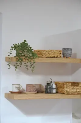 two wooden shelves with cups and plants on them at Heart of Athens Stay #5 in Athens