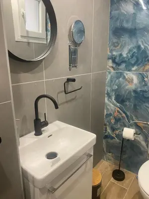a bathroom with a sink and a mirror at Heart of Athens Stay #5 in Athens